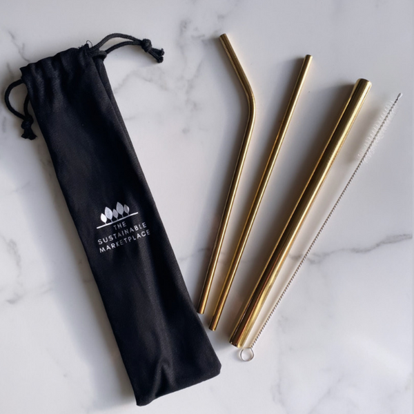 A set of Reusable Stainless Steel Straws in gold