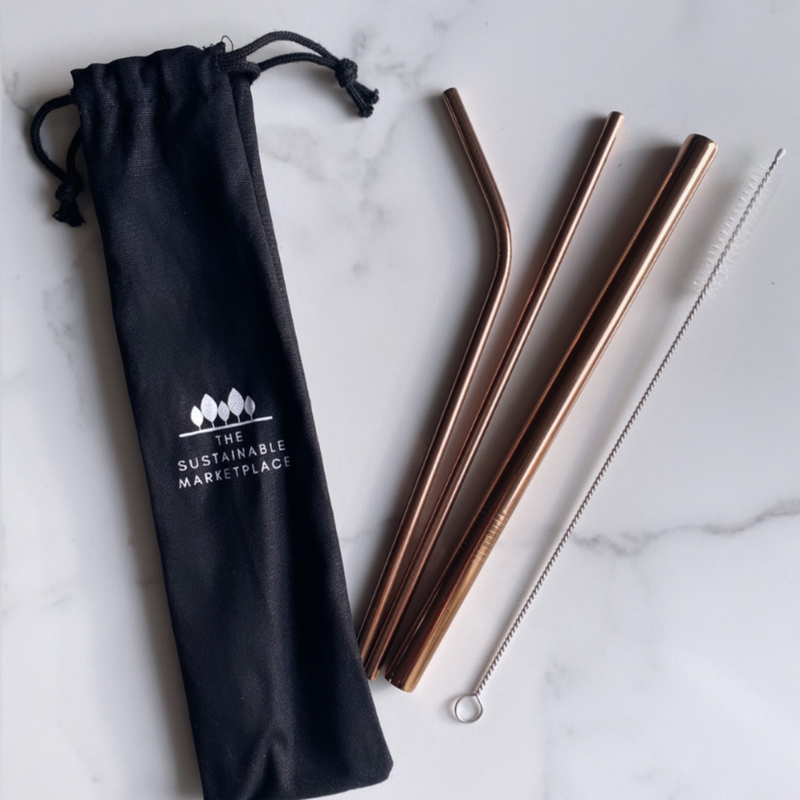 A set of Reusable Stainless Steel Straws in rose gold